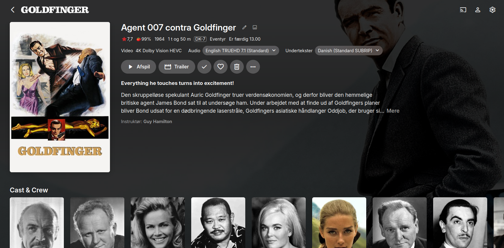 Screenshot fra Emby Medieserveren der viser siden om Goldfinger 4k UHD. Oprindelig plakat og wallpaper er Sean Connery der læner sig op sin Aston Martin i Schweiz