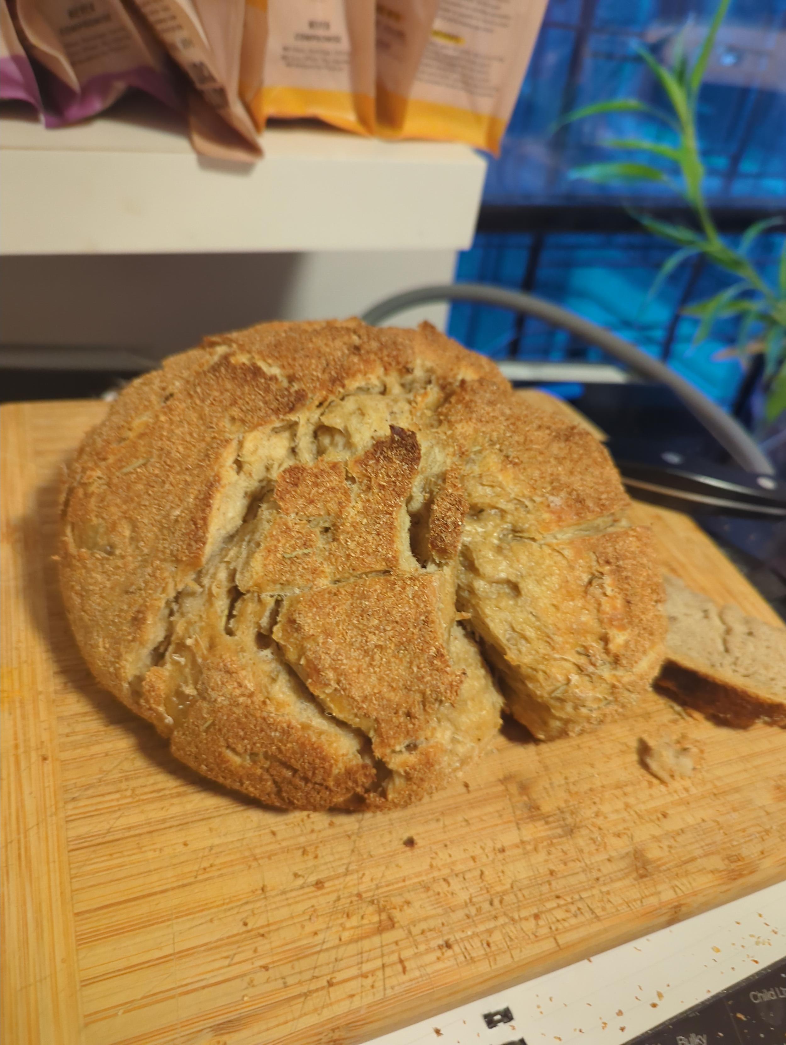 bread covered in wheat bran, ripped into by myself and my fiance after we couldnt't wait any longer